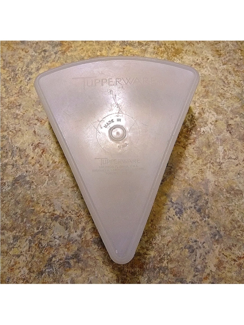 Vintage triangle Tupperware container.